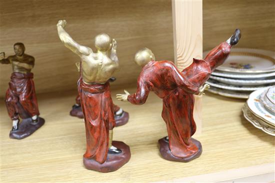 A set of four ceramic figures of boxers